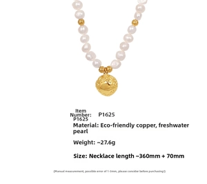 Detail showing freshwater pearls and gold-plated copper pendant on clavicle necklace