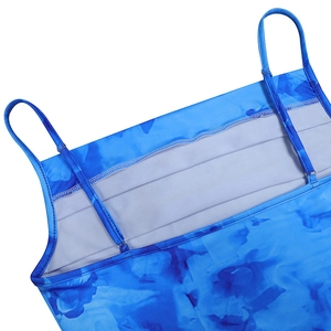 Detailed view of the blue printed top with fine straps and double-stitched neckline finish