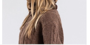 Detail of brown cable knit winter hat and scarf set showing warm textured wool weave