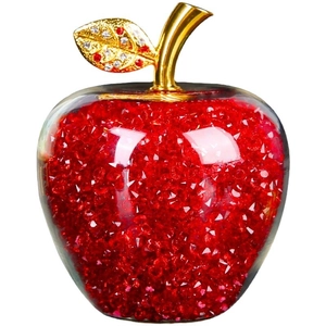 Red crystal apple ornament with gold leaf and diamond detail on white background