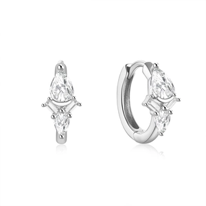 Detail of S925 silver hoop earrings with pear and baguette cut sparkling cubic zirconia