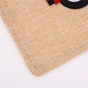 Detailed macro view showing the natural jute fabric texture and precise edge stitching
