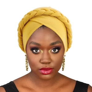 Elastic yellow knitted turban hat featuring a thick braided design for women