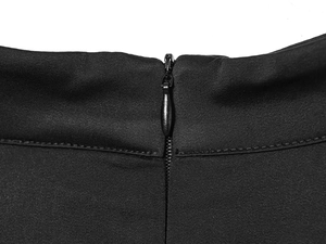 Close-up of the invisible zipper and high-density fabric stitching on the black V-neck shirt