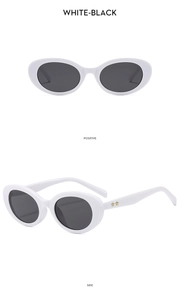 Detailed views of white oval sunglasses featuring gold star emblems on the temples
