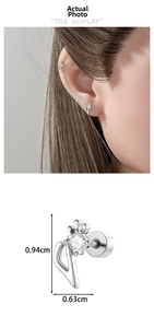 Macro view of silver note stud earring with clear zircon and dimensions 0.94cm x 0.63cm