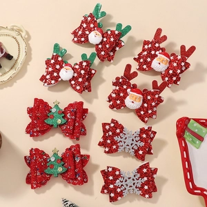 Christmas bow hair clip set with reindeer antlers and santa motifs in festive red and green
