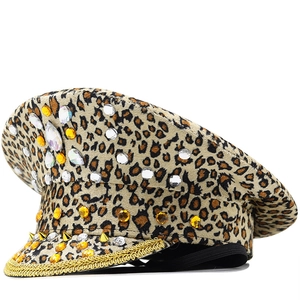 Macro detail of leopard captain hat with gold studs and sparkling crystal rhinestones