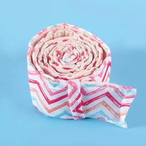 Close-up of cotton bake even strip with pink and blue chevron pattern on blue background