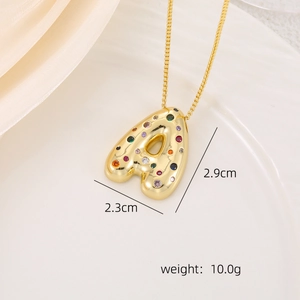 Macro detail of 3D gold letter A pendant with colorful zircon stones and size info