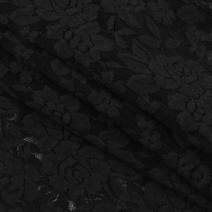 Close-up of the delicate black lace fabric with intricate floral embroidery details