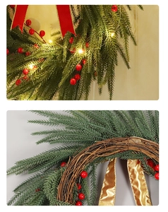 Détails d'une couronne de Noël avec baies rouges, lumières LED et base en rotin naturel