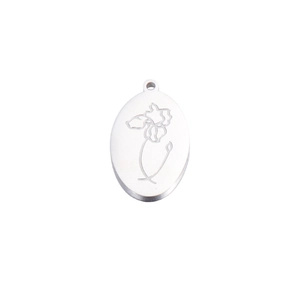 Close-up of oval stainless steel pendant with fine engraved floral pattern and polished finish