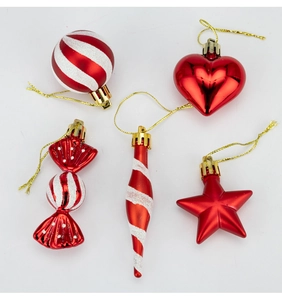 Close-up of red and white 5-piece Christmas tree ornaments with candy and star shapes