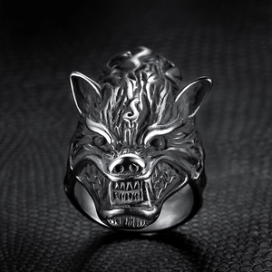 Rugged Viking wolf head ring in silver stainless steel on textured black background
