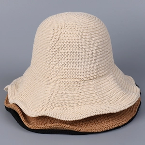Close-up of lightweight crochet knit sun hats showing honeycomb texture in three colors
