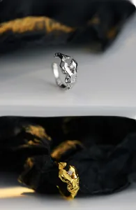 Macro shot of lava texture ear cuff with micro-pave cubic zirconia on irregular silver band