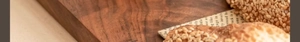 Close-up of a high-quality dark wood grain cutting board with natural textured surface
