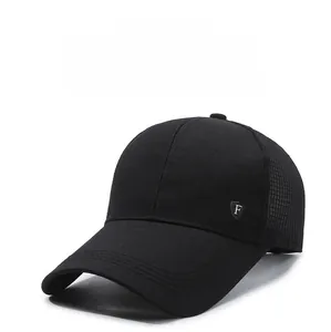 Close-up of black mesh baseball cap featuring a premium metal shield F logo detail