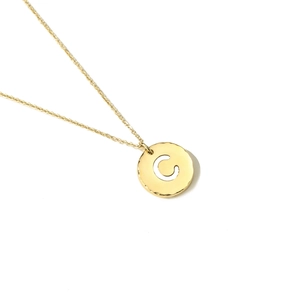 Close-up of a gold-plated stainless steel necklace with a hammered letter C pendant