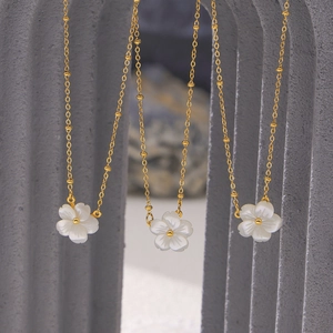 Elegant 18K gold plated titanium necklaces with white shell flower pendants on bead chains