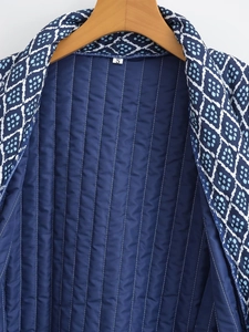 Detail of Y2K style quilted jacket showing S size label and geometric diamond pattern