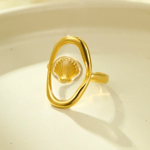 Adjustable gold ocean ring featuring a 3D seashell design inside a clear resin oval frame