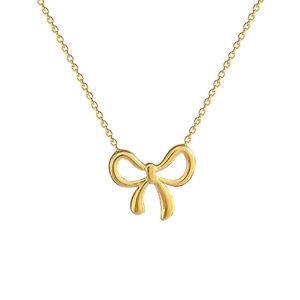Elegant gold titanium steel necklace with a minimalist bow pendant on white background