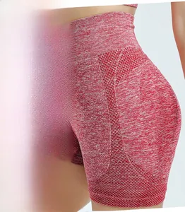 Detail view of high waist red space-dye yoga shorts with butt lifting seam and wide waistband