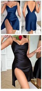 Detail of a navy satin slip dress featuring high side slits and a deep V-back design