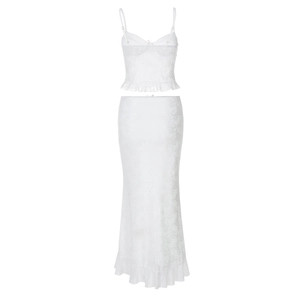 Close-up of white lace two-piece set with floral texture and ruffled hem details