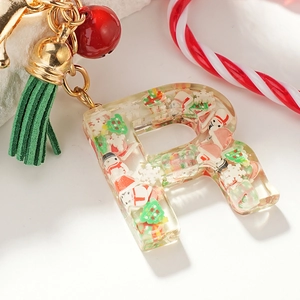 Transparent resin letter R Christmas keychain with snowman and festive decor inside
