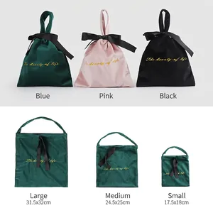 Luxury velvet drawstring pouches in pink, blue and black with gold embroidery and bow