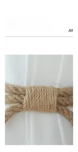 Macro detail of hand-woven cotton linen curtain tieback with Nordic knot craftsmanship