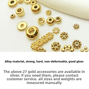 Detailed macro view of high-gloss gold alloy snowflake spacer beads for jewelry making