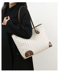 Detailed shot of large capacity tote bag with geometric pattern and slim shoulder straps