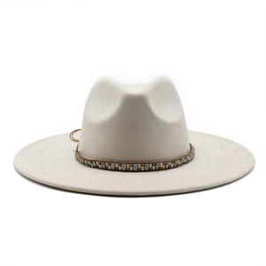 Detail of off-white wide-brim felt hat with vintage beaded band and braided trim