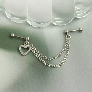 Detail of stainless steel double stud chain earring with heart zircon pendant