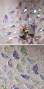Macro shot of 3D holographic butterfly nail art stickers with laser finish and embossed detail