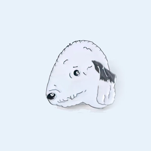 Detailed view of white cartoon dog enamel pin badge with black outlines and zinc alloy finish