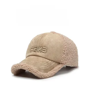 Macro detail of winter baseball cap featuring letter embroidery and faux shearling trim
