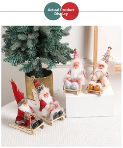 Detailed view of four Santa Claus figurines on wooden sleds with bell hats and hangers