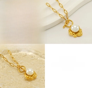 Detail view of 18K gold titanium steel necklace with pearl pendant and stylish OT buckle
