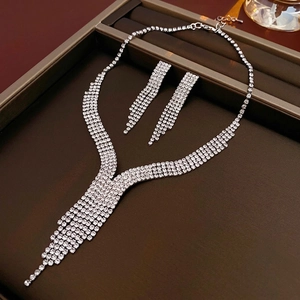 Luxury silver waterdrop fringe necklace and earrings set with shimmering rhinestones