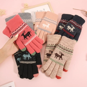 Winter touch screen knitted gloves with reindeer pattern in various colors on pink background