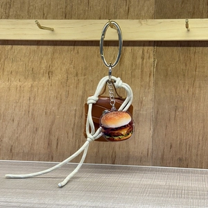 Y2K style woven rope mini bag charm with brown leather bag and hamburger acrylic pendant