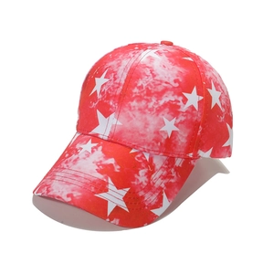 Red and white tie-dye baseball cap with large star pattern and curved brim