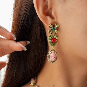 Baroque style gold earrings with green floral studs, red hearts and cameo pendants