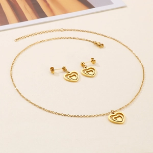 Golden heart necklace and earrings set with double-layered hollow heart pendants