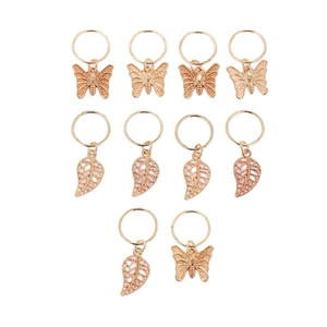 Set of 10 gold metal hair rings with hollow butterfly and leaf charms on white background